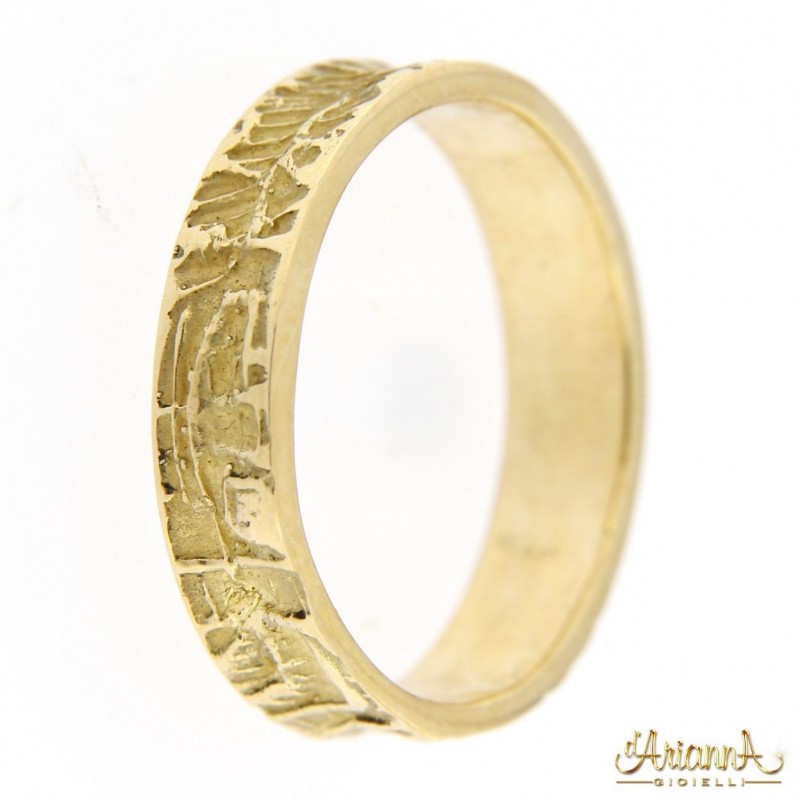 Fede lavorata unisex in oro giallo 18kt
