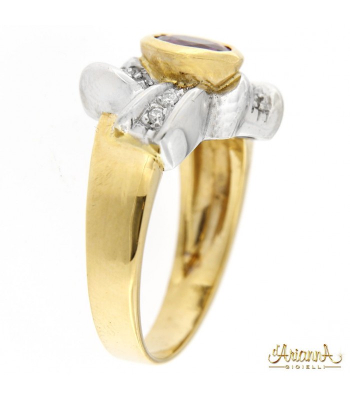 Anello in oro 18kt bicolore giallo e bianco con Rubino 0,70ct. e diamanti 0,28ct.